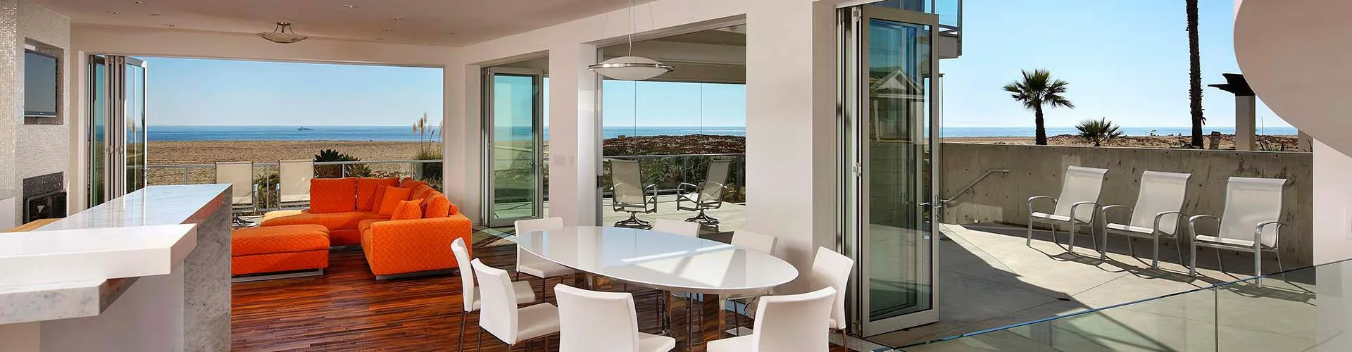 Lanai folding glass doors connecting an interior living space to the outdoors