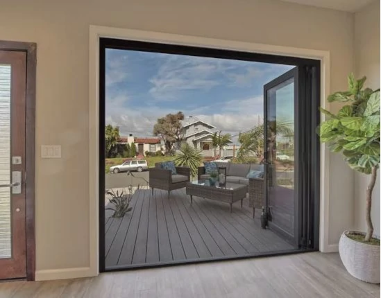 Residential installation of aluminum folding glass wall with indoor outdoor sealing and smooth operation.