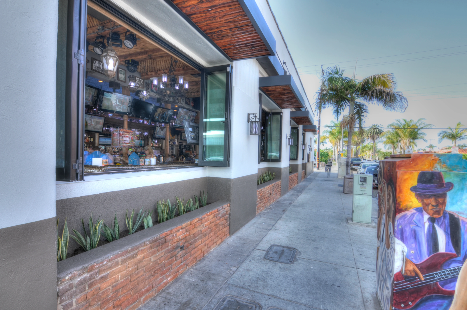Luxury modern restaurant façade with wide commercial folding opening system.