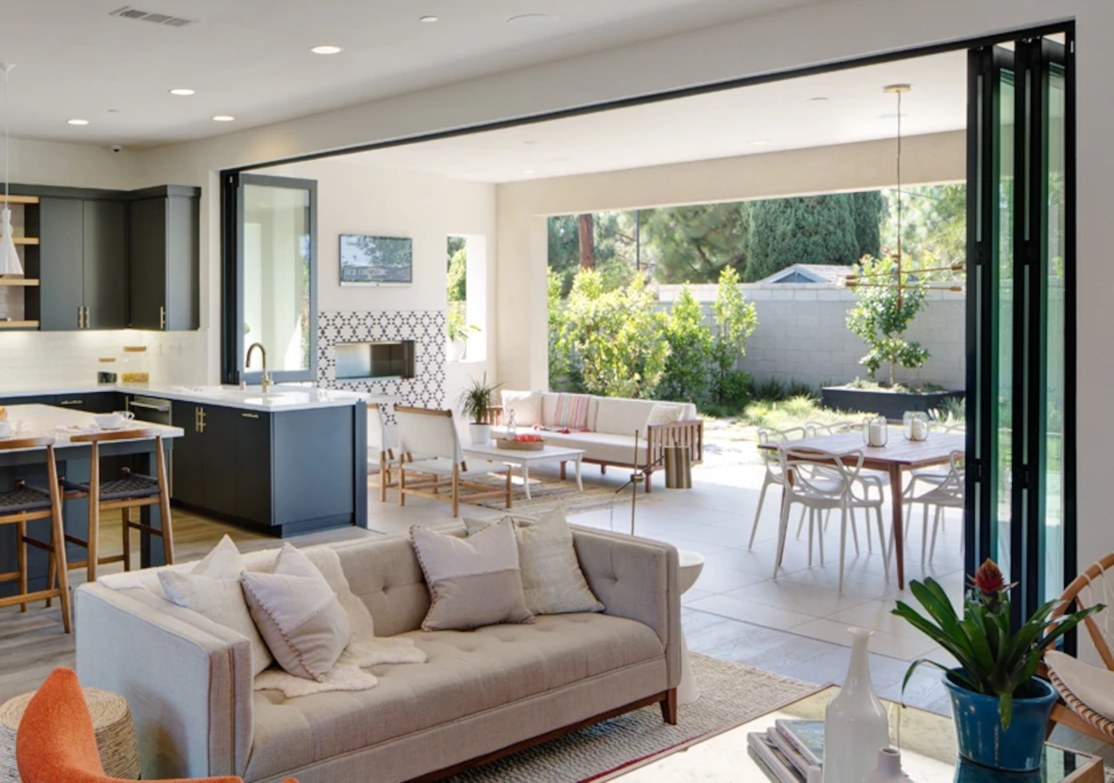 Large residential opening using movable door and window glass panels.