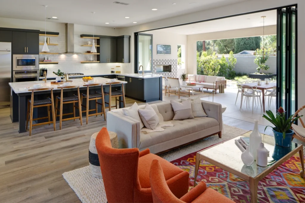 Operable bifolding door and window combination system creating large indoor-outdoor opening.
